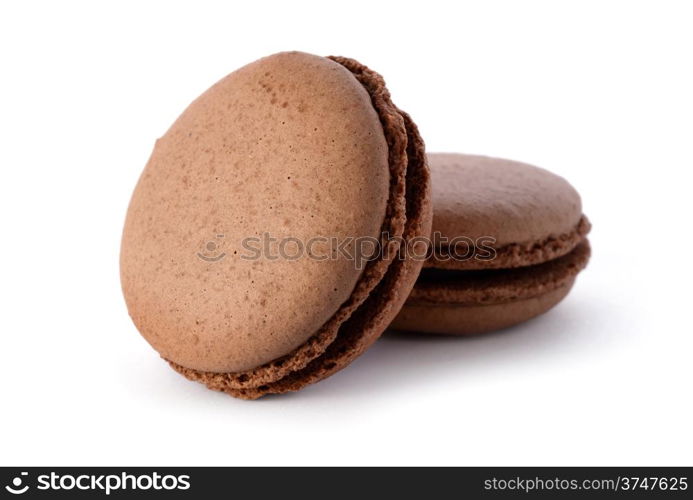 Food: group of fresh chocolate macarons, isolated on white background