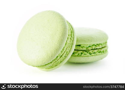 Food: group of fresh green macarons, isolated on white background