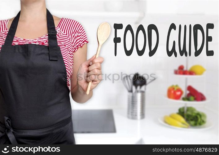 food guide cook holding wooden spoon background concept. food guide cook holding wooden spoon background concept.