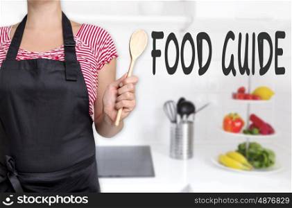 food guide cook holding wooden spoon background concept. food guide cook holding wooden spoon background concept.