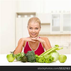 food, healthcare and dieting concept - smiling sporty woman with organic food