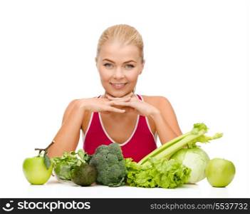 food, healthcare and dieting concept - smiling sporty woman with organic food