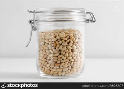 food, healthy eating and diet concept - jar with dried peas on white background. close up of jar with dried peas on white table