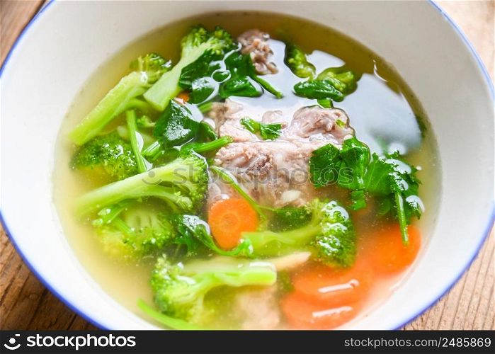 Food healthy menu, Clear Soup bowl with pork ribs vegetable carrot broccoli soup and celery