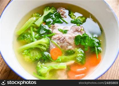 Food healthy menu, Clear Soup bowl with pork ribs vegetable carrot broccoli soup and celery