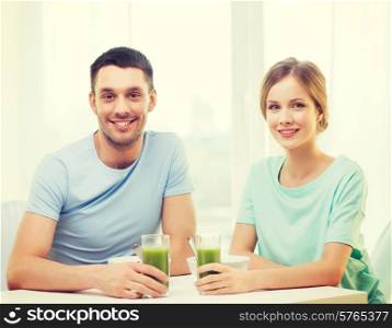 food, home, couple and happiness concept - smiling couple having breakfast at home