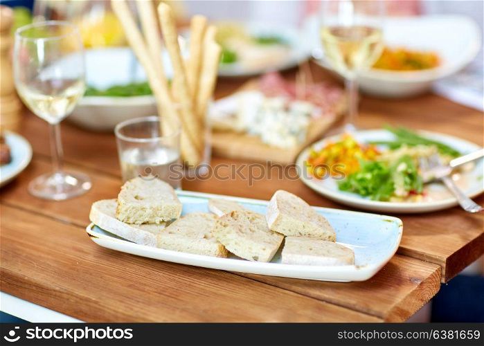 food, junk-food and unhealthy eating concept - white bread slices on plate. white bread slices on plate