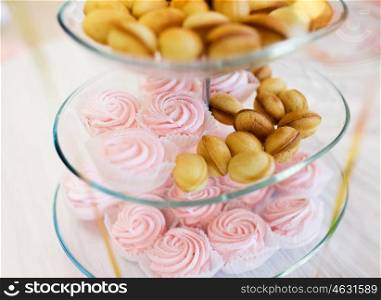 food, junk-food, culinary, holidays and eating concept - close up of sweet custard dessert and cookies on glass serving tray