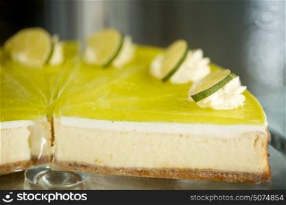 food, junk-food, pastry, baking and dessert concept - pieces of lime cake on stand. pieces of lime cake on stand
