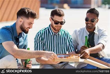 food, leisure and people concept - happy male friends drinking beer and eating takeaway pizza on street in summer. male friends eating pizza with beer on street
