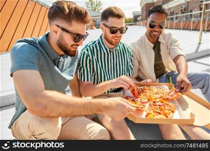 food, leisure and people concept - happy male friends drinking beer and eating takeaway pizza on stairs at rooftop party in summer. male friends eating pizza with beer on rooftop