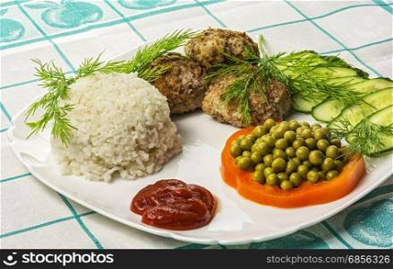 Food. Meat cutlet with boiled rice and vegetables