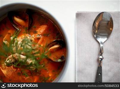 food, new nordic cuisine, culinary and cooking concept - close up of seafood soup with fish and blue mussels in bowl. close up of seafood soup with fish and mussels. close up of seafood soup with fish and mussels