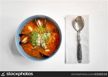 food, new nordic cuisine, culinary and cooking concept - seafood soup with fish and blue mussels in bowl. seafood soup with fish and blue mussels in bowl