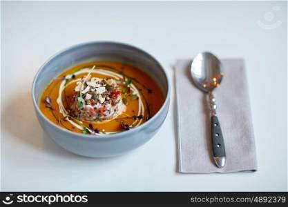 food, new nordic cuisine, dinner, culinary and cooking concept - close up of vegetable soup in bowl