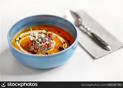 food, new nordic cuisine, dinner, culinary and cooking concept - close up of vegetable soup in bowl. close up of vegetable soup in bowl