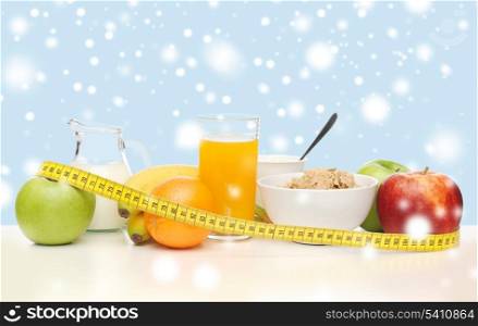 food, nutrition, slimming, diet concept - healthy breakfast and measuring tape