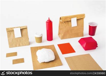 food packages with disposal cup sauce bottle white background