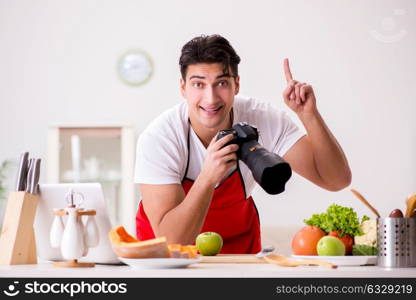 Food photographer taking photos in kitchen