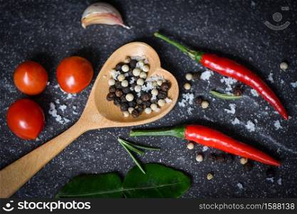 food plate herbs and spices with pepper chili tomato garlic for cooking thai asian food , top view