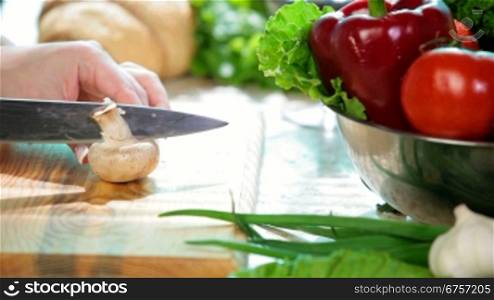 Food Preparation - women hands chopped mushrooms Champignons