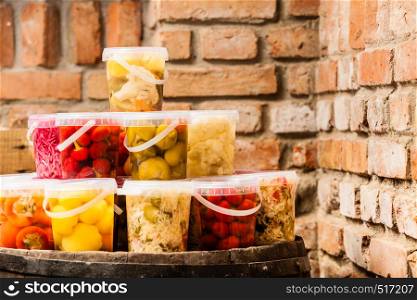 Food preserving for autumn winter time. Jars with pickled vegetables in cellar. Jars with pickled vegetables in cellar
