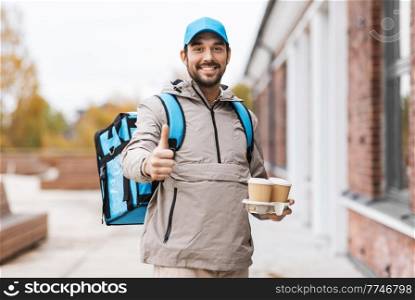 food shipping, profession and people concept - happy smiling delivery man with thermal insulated bag and takeaway paper coffee cups in city. happy delivery man with thermal bag and coffee