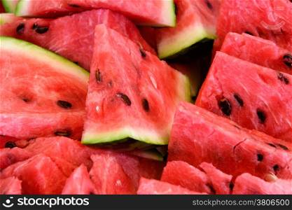 Food: slices of watermelon, arranged as background pattern, close-up shot