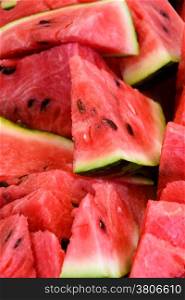 Food: slices of watermelon, arranged as background pattern, close-up shot