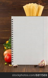 food spice and cookbook on wooden background