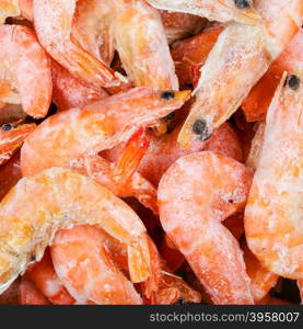 food square background - frozen boiled red shrimps close up