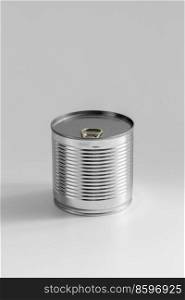 food storage and eating concept - close up of tin can with preserve on table. close up of tin can with preserved food on table