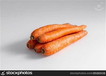 food, vegetables and healthy eating concept - close up of ripe carrots on table. close up of ripe carrots on table