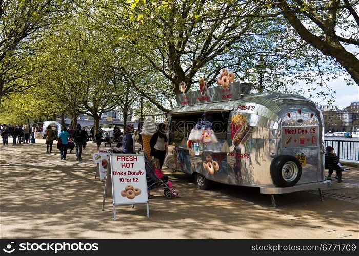 Food vendor serving locals and tourists along the River Thames