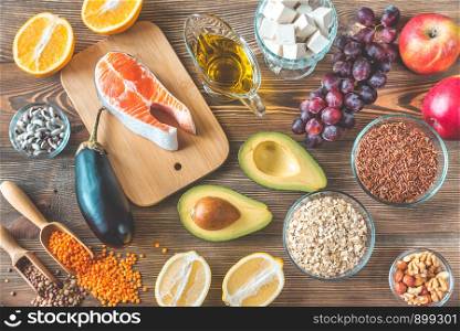 Foods providing low cholesterol diet on the wooden background