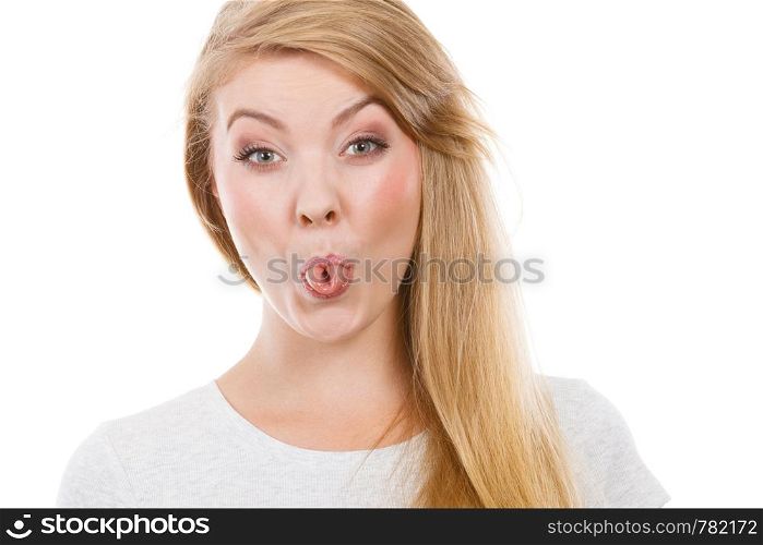 Fooling around, making silly faces concept. Blonde woman having tongue in clothespin. Funny blonde woman sitcking tongue out