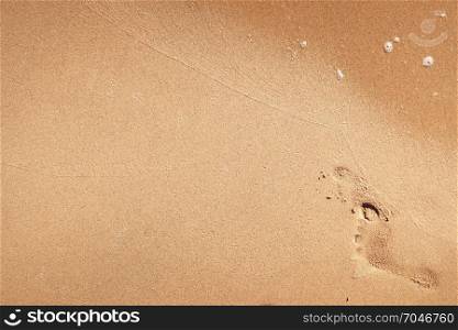 Foot print on a sandy beach