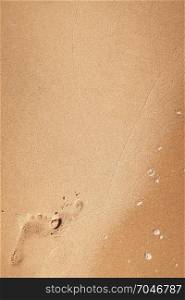 Foot print on a sandy beach