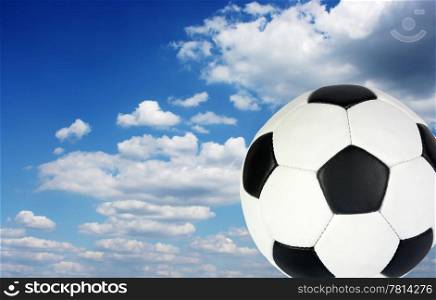 Football ball in the sky, background