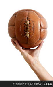 Football ball vintage retro brown leather in man hand