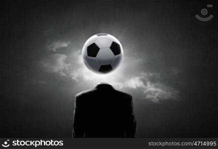 Football face. Unrecognizable man with soccer ball instead of head