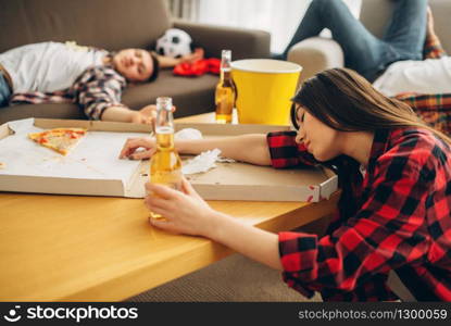 Football fans sleeping at home, hangover morning. Drunk friends after celebration of the victory of favorite team, party with beer, pizza and popcorn. Football fans sleeping at home, hangover morning
