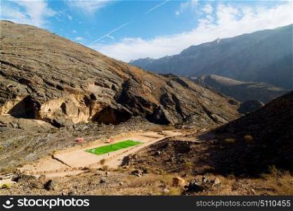 football field gorge and canyon the deep cloudy sky in oman the old mountain