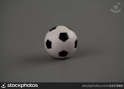 Football isolated on gray