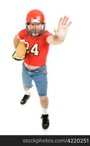 Football player carries a giant sub sandwich like its a foot-ball. Full body isolated on white.