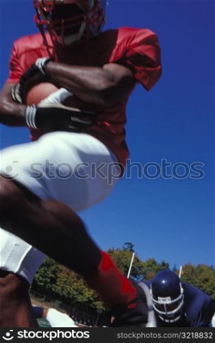 Football Player Running with Ball