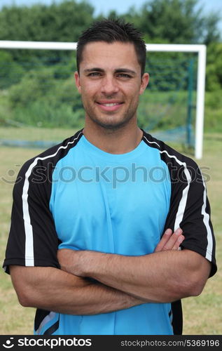 Football player stood on pitch