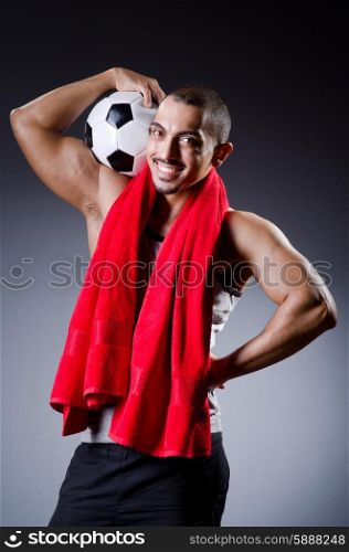 Football player with ball and towel