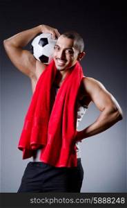 Football player with ball and towel