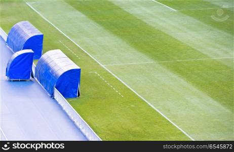 Football soccer field with coach bench. Football soccer green field with coach bench on the stadium